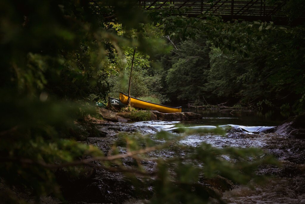 Canoes on the shore, on a beginner canoe river trip