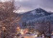 A downtown view of the city of Rossland in winter at dusk.