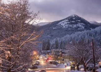 A downtown view of the city of Rossland in winter at dusk.