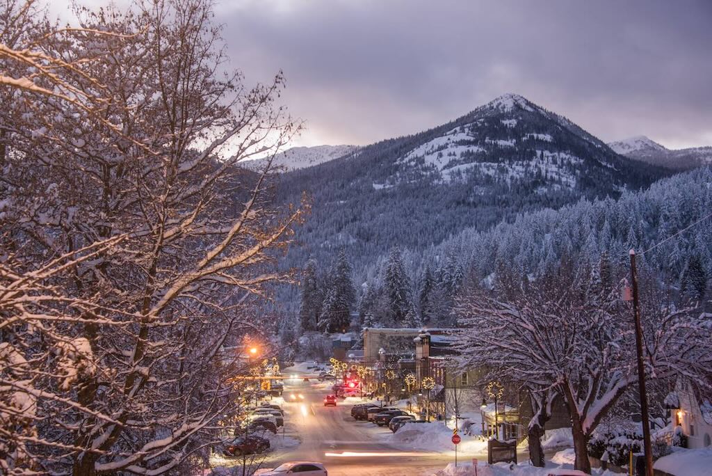 A downtown view of the city of Rossland in winter at dusk.