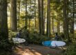 riding through forest to surf in Tofino, BC